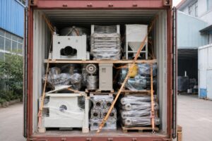 A fully loaded 40HQ container with neatly arranged plastic extrusion line components