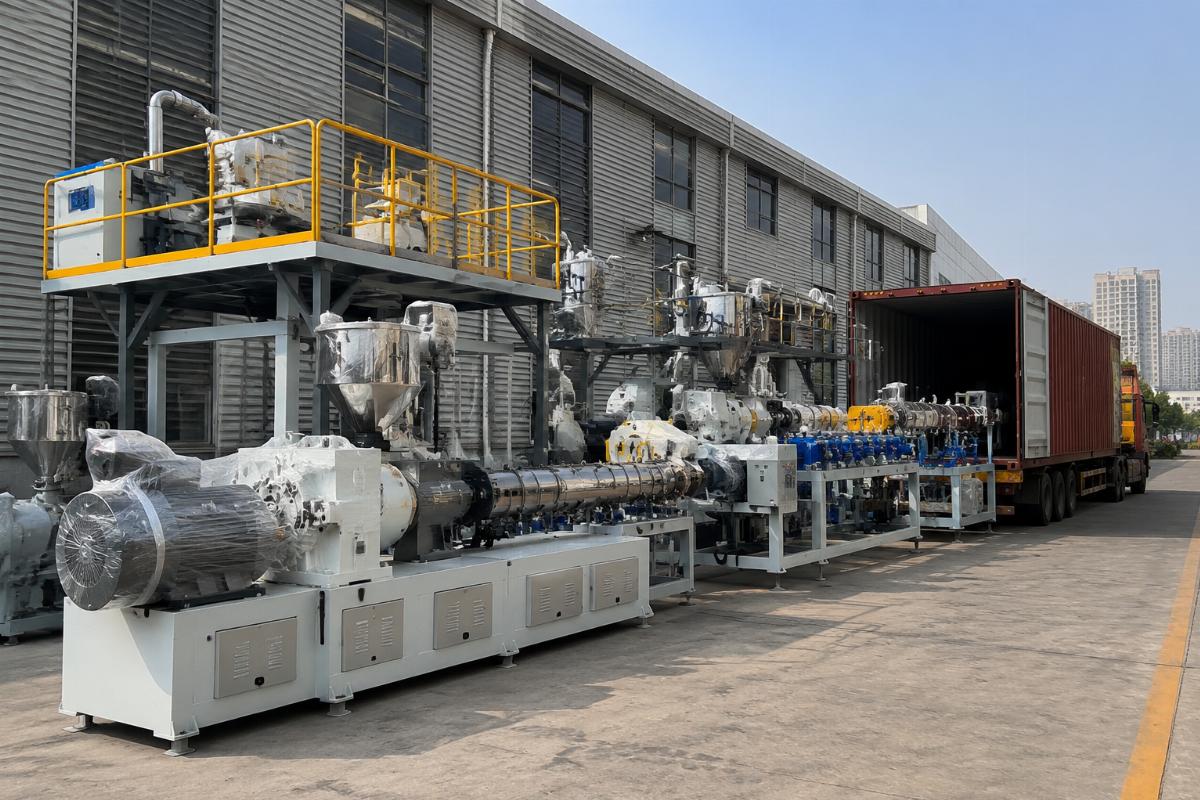 Fully assembled plastic extrusion lines staged for container shipping at a manufacturer facility